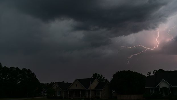 Capture of a lightning storm over suburban homes in North Carolina, USA.