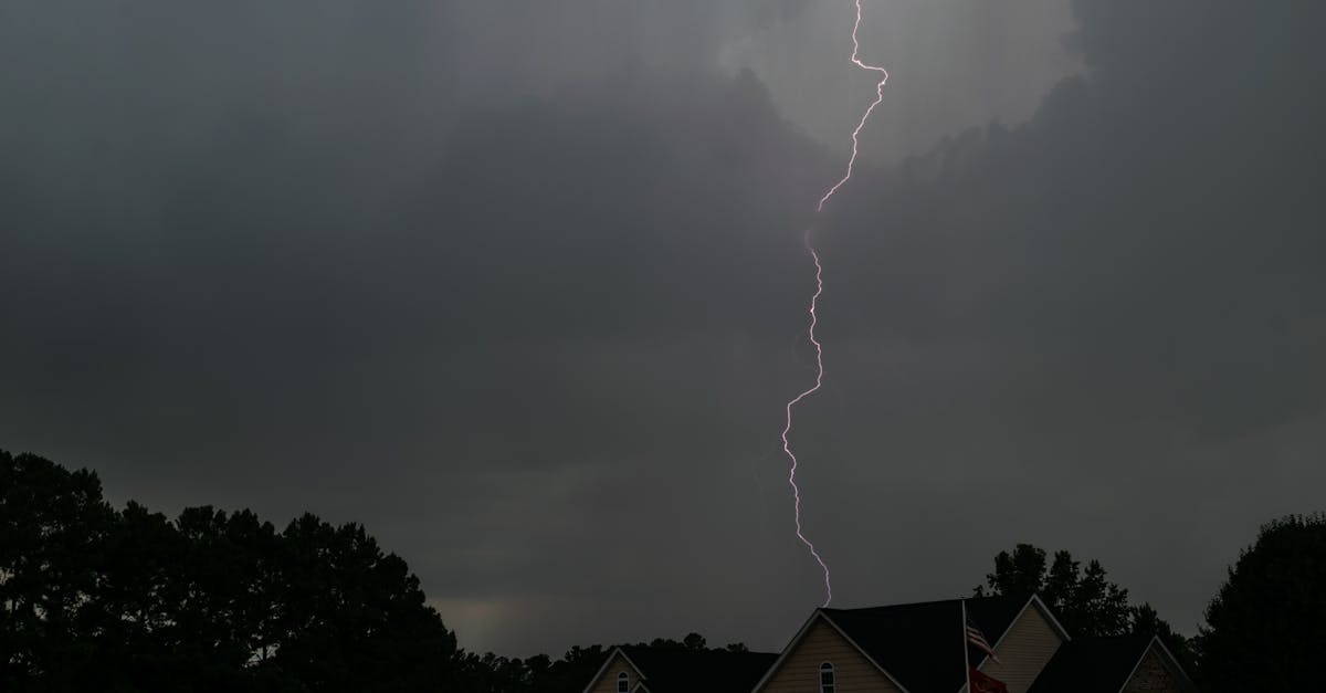 A striking lightning bolt pierces the stormy sky over suburban houses in North Carolina.