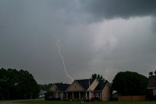 Storm Cloud and Lightning over House