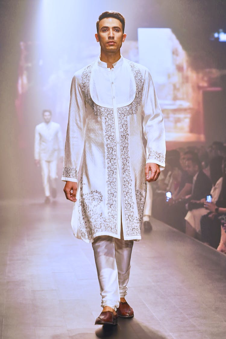 Man In Traditional Indian Costume Walking On Runway