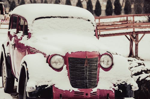 Snow Covered Red Vintage Car 