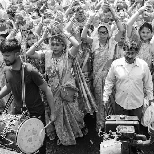 Grayscale Photo of People in Traditional Clothing