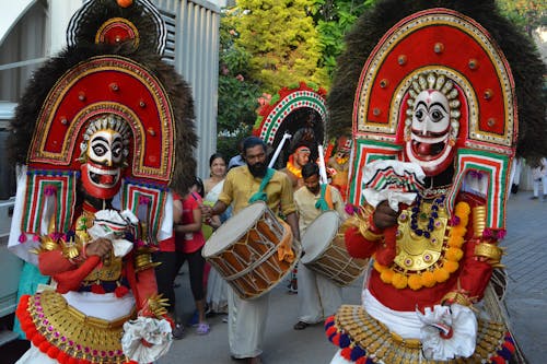 Free Traditional Folk Dancers in Thira Costumes during a Festival in Kerala, South India Stock Photo