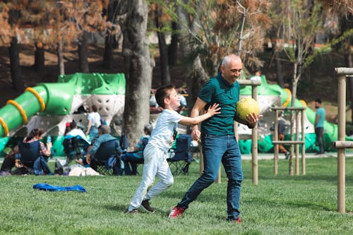 Father and Son Playing on the Field