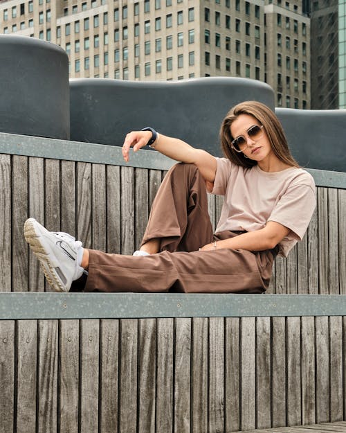 Woman in Brown Clothes Posing