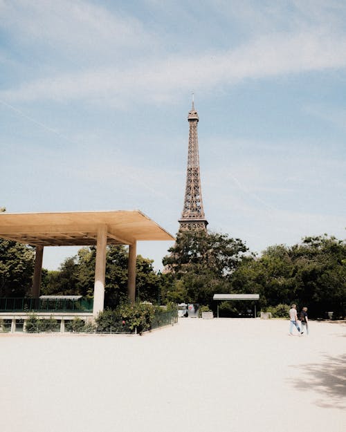 Free View of the Eiffel Tower from a Park Stock Photo