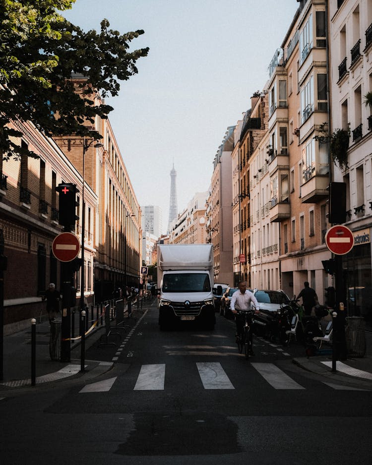 Delivery Van Driving On Narrow City Street