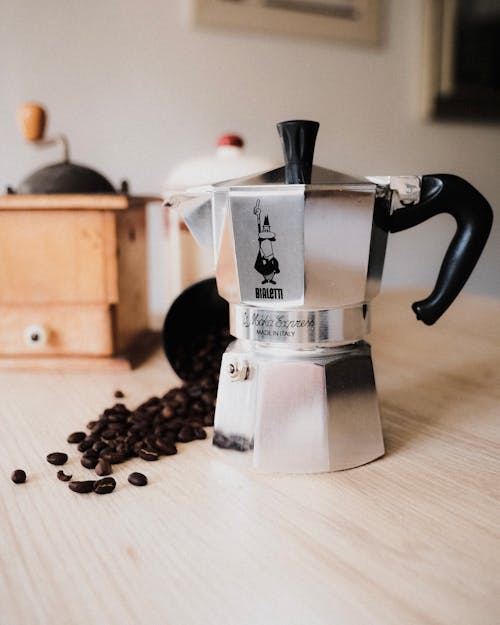 Free Coffee Beans and Coffee Maker Stock Photo