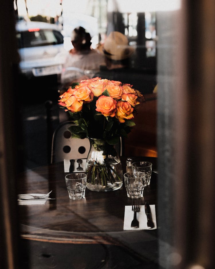 Roses In Vase On Restaurant Table