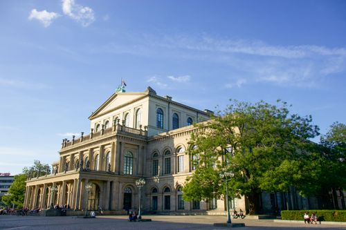 Free Historic Hannover Opera House with classical architecture in sunny weather, featuring urban surroundings. Stock Photo