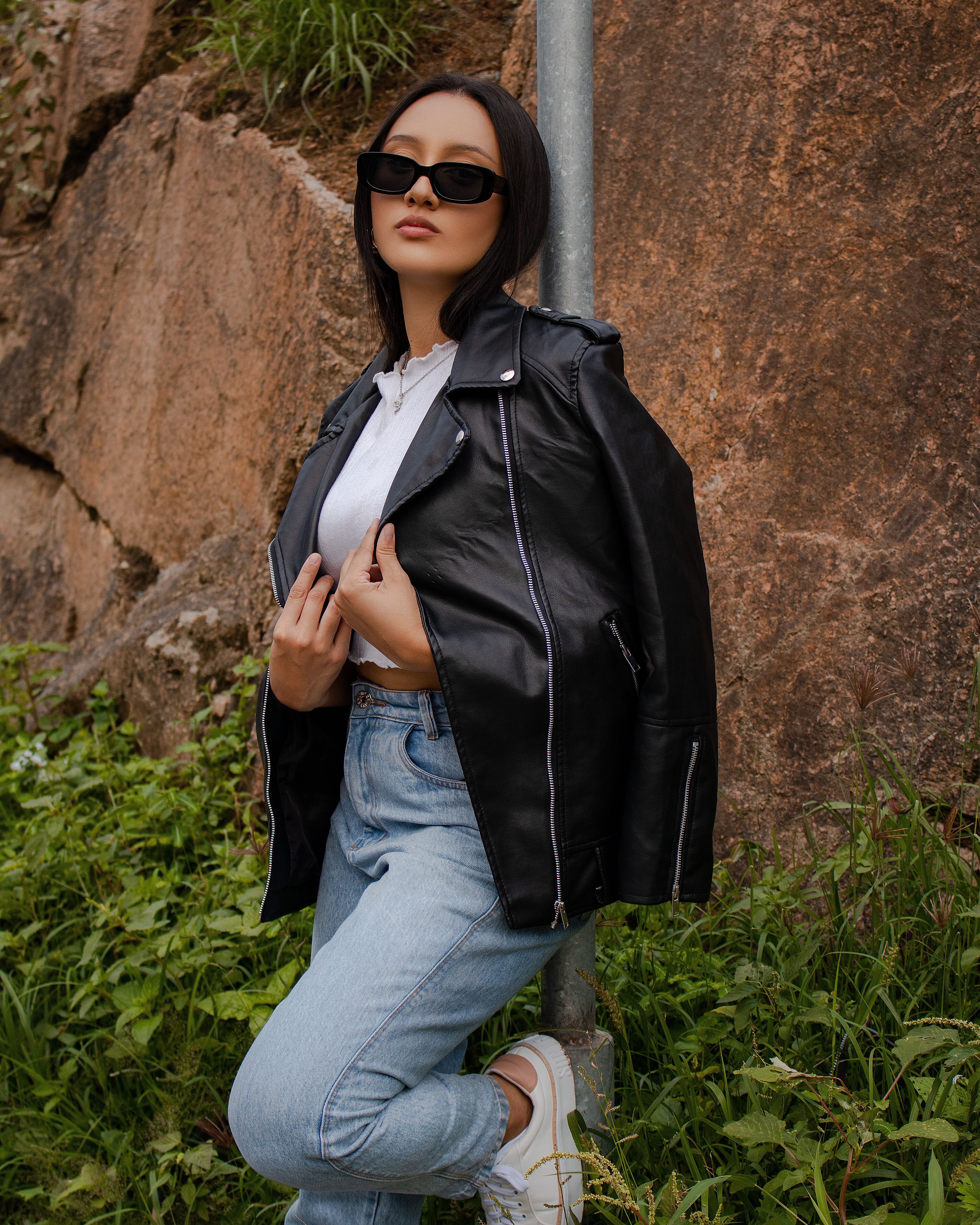 A Woman in Black Leather Jacket Posing at the Camera · Free Stock Photo