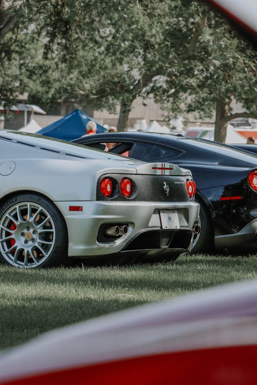 A Silver Ferrari a a Car Show