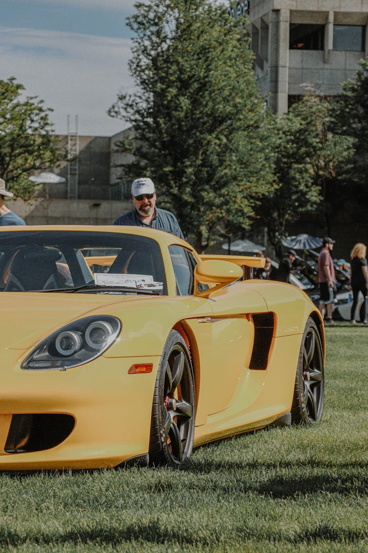 Yellow Car Parked On Green Grass