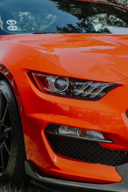 Orange Sportscar in Close Up Photography