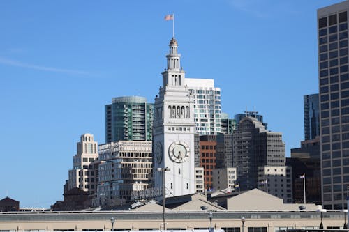 Historical Ferry Building beside High-rise Buildings 