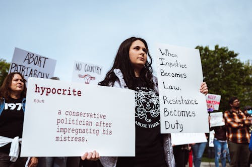 Free Woman with Signs at Protest Stock Photo