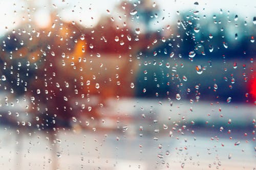 Close-Up Photography of Droplets on Glass