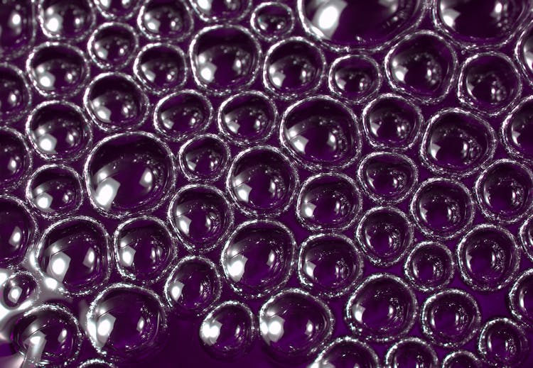 Close-up Photo Of Bubbles On A Violet Surface 