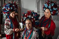 Women with Flowers in Traditional Clothing