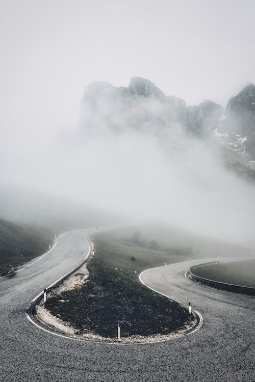 Curvy Mountain Road Under the Thick Fog 