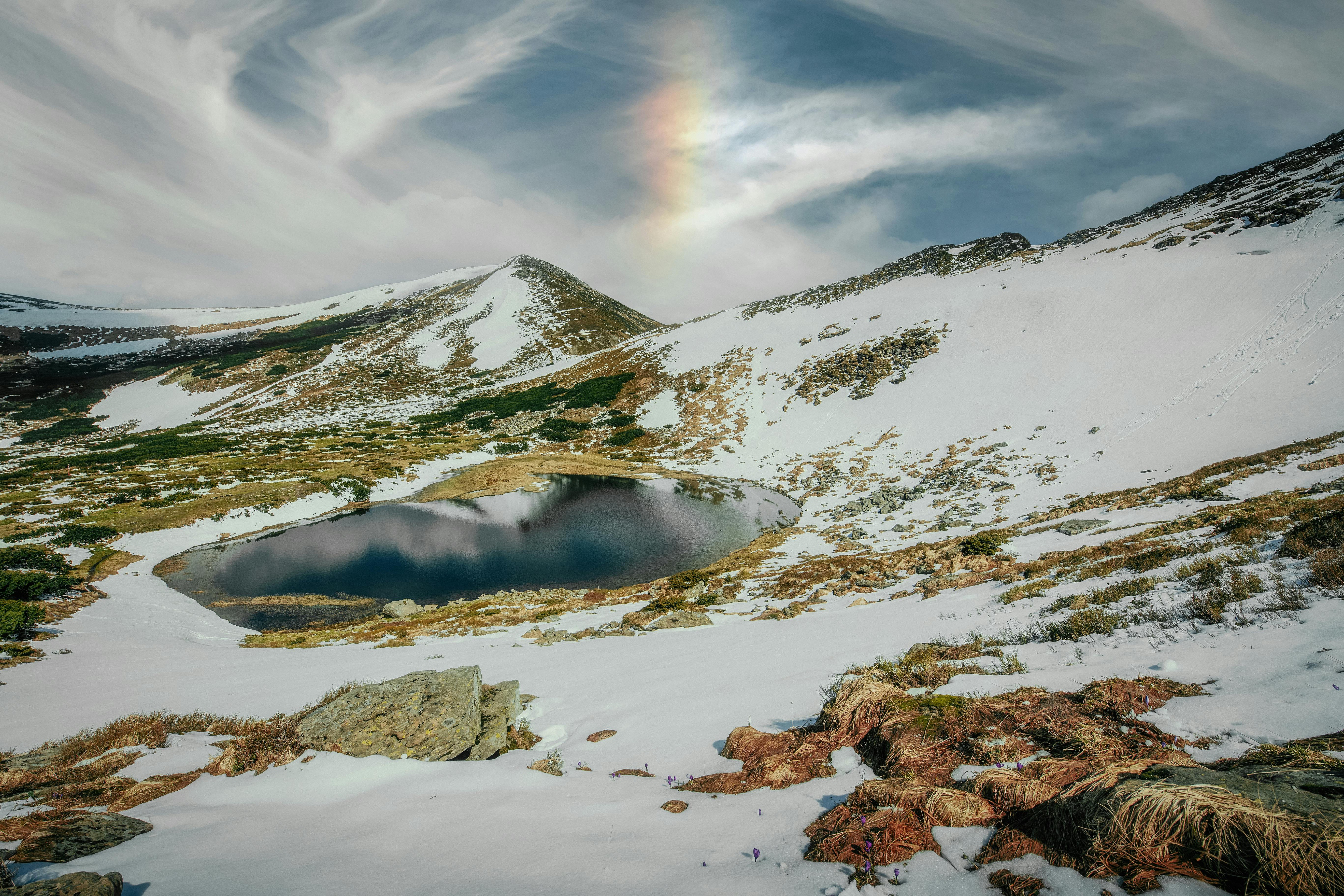 Free Snow Covered Mountain Under Cloudy Sky Stock Photo