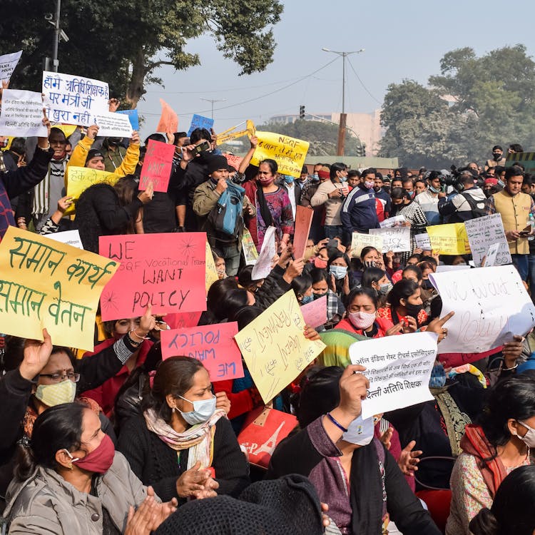 Group Of People Holding Protest Signs