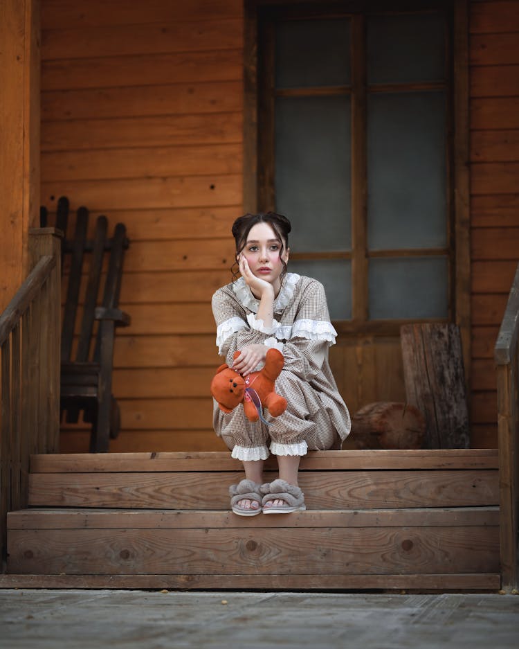 Concerned Woman Waiting On Porch