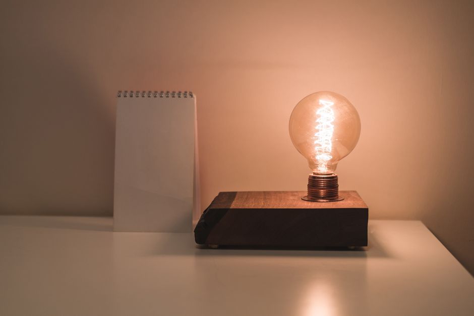 journal and lamp on desk real home lifestyle photo 1