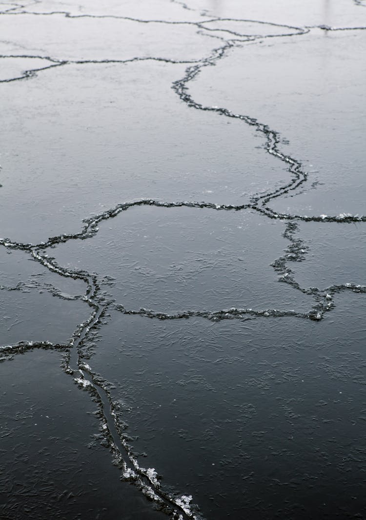 Photograph Of Ice With Cracks