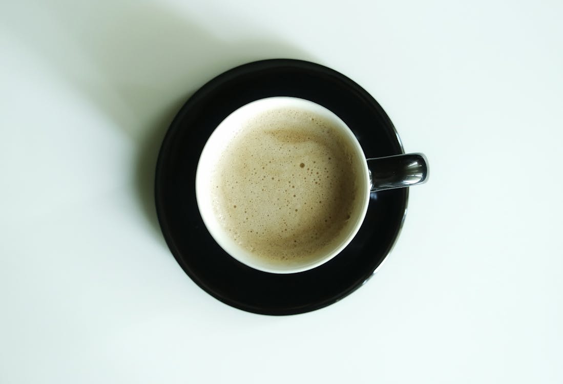 Free Flat Lay Photography of Latte Inside White Ceramic Mug Stock Photo