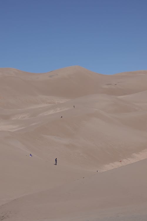 Sand Dunes Under Blue Sky