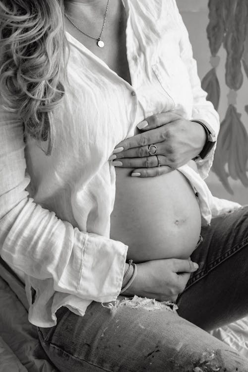 Free Pregnant Woman Holding Her Belly  Stock Photo