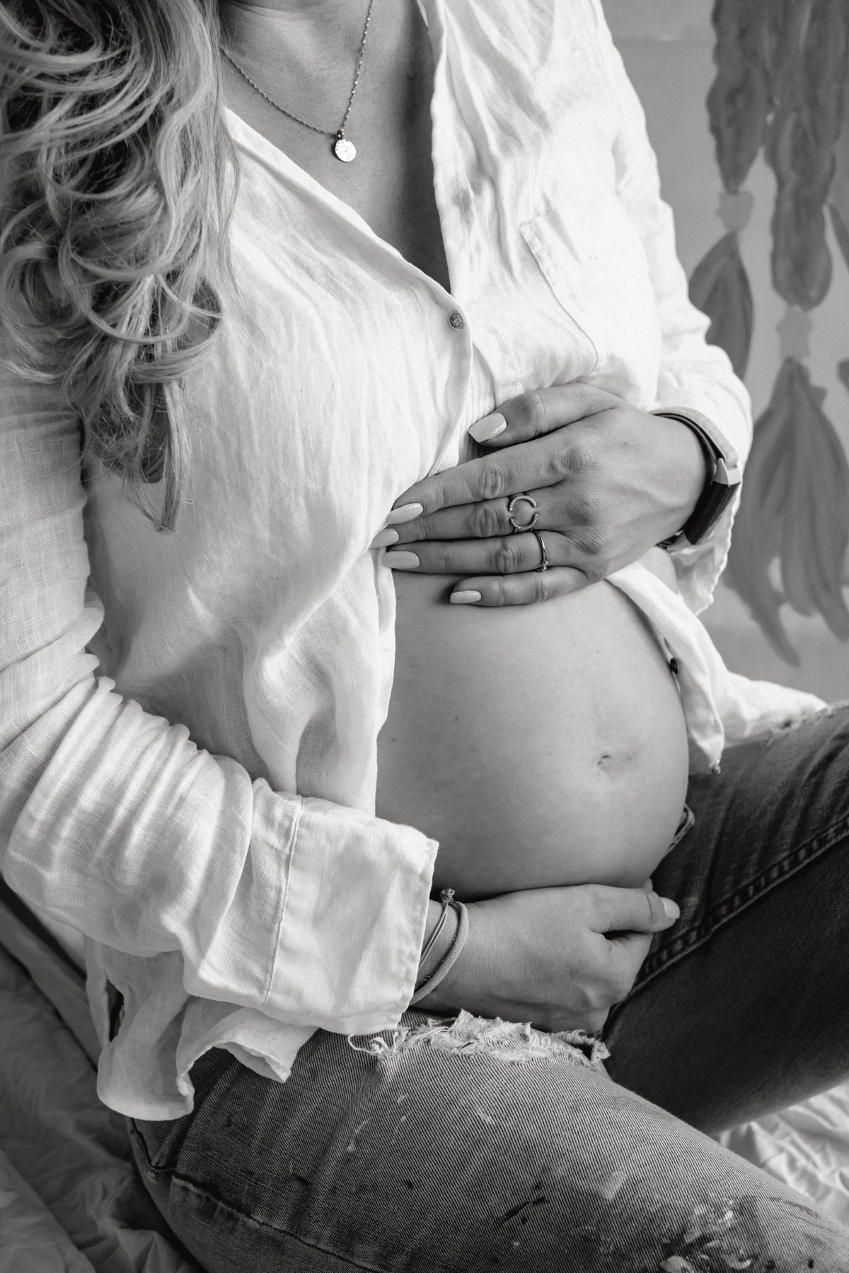 Pregnant woman holding belly