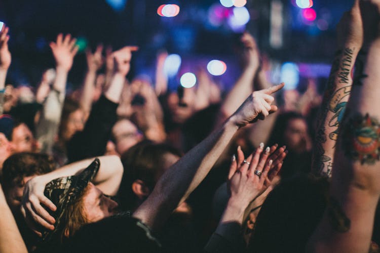 Photo Of People Raising Their Hands