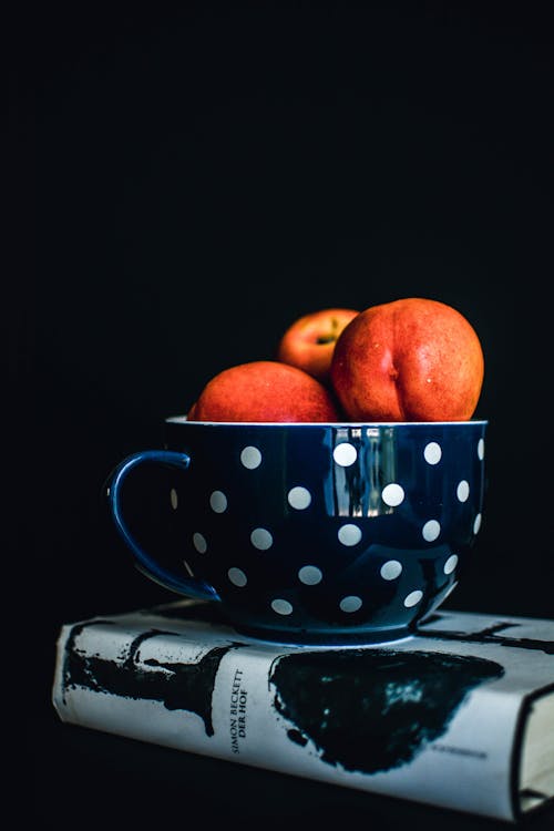 Free Three Red Apples on White and Black Polka-dot Mug Stock Photo