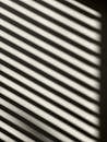 Striped Shadow on a White Wall