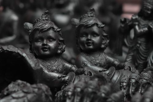 Free Close-up of dark Hindu figurines capturing spirituality in Agra market. Stock Photo