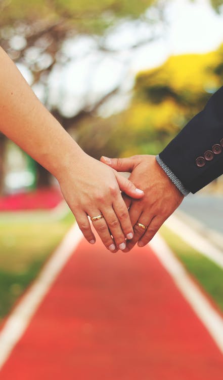 Free Bride and Groom Holding Hands Stock Photo