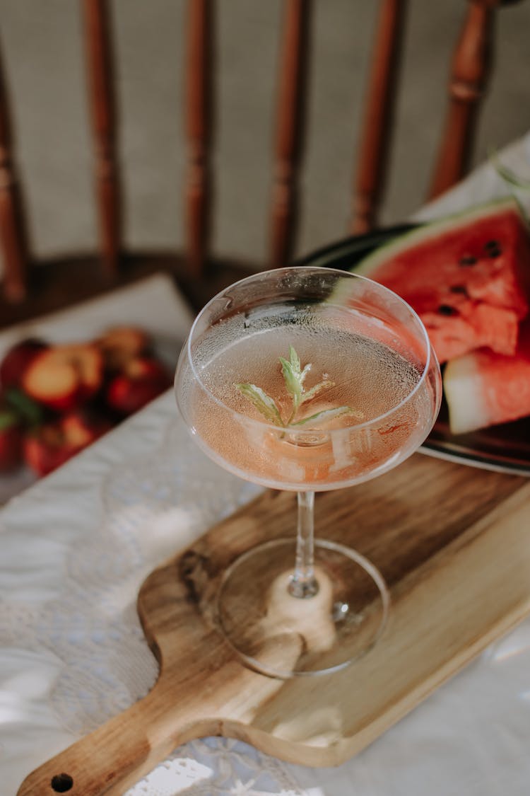 Glass Of Cocktail On A Cutting Board And Fruits