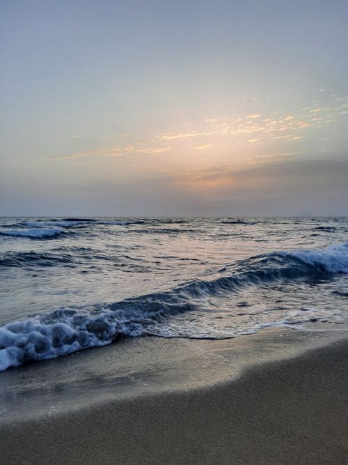 Free Experience the calming waves of Lido Signorino beach during a picturesque sunset in Sicilia, Italy. Stock Photo