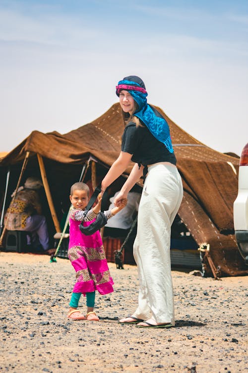Free Woman and Child on Desert Camp Stock Photo
