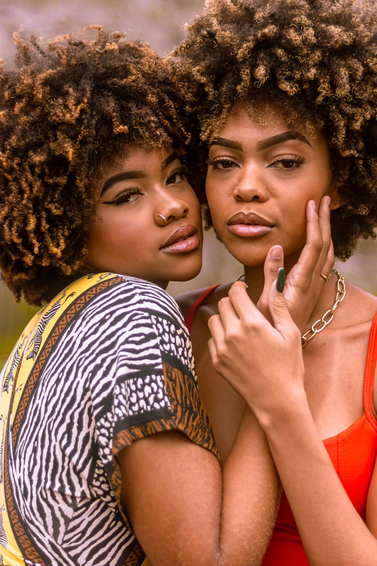 Portrait Of Young Women Couple Hugging 