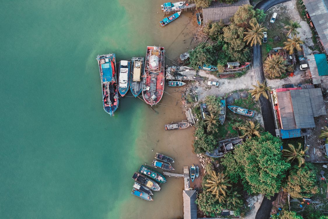 Birds Eye View of Wooden Boats on the Shore · Free Stock Photo