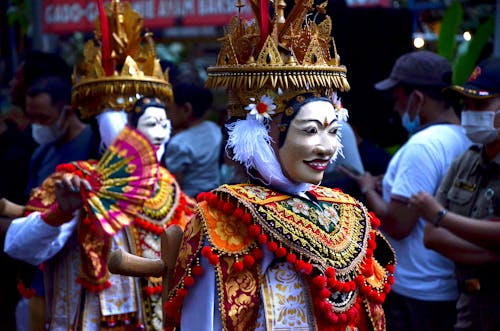 Close-up Photo of People in Traditional Wear 