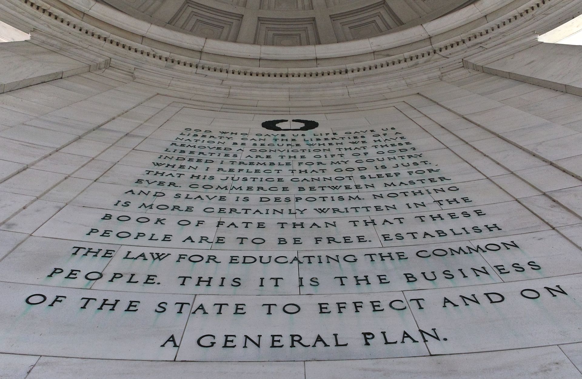 Detailed view of text inside the Thomas Jefferson Memorial, emphasizing historical significance.