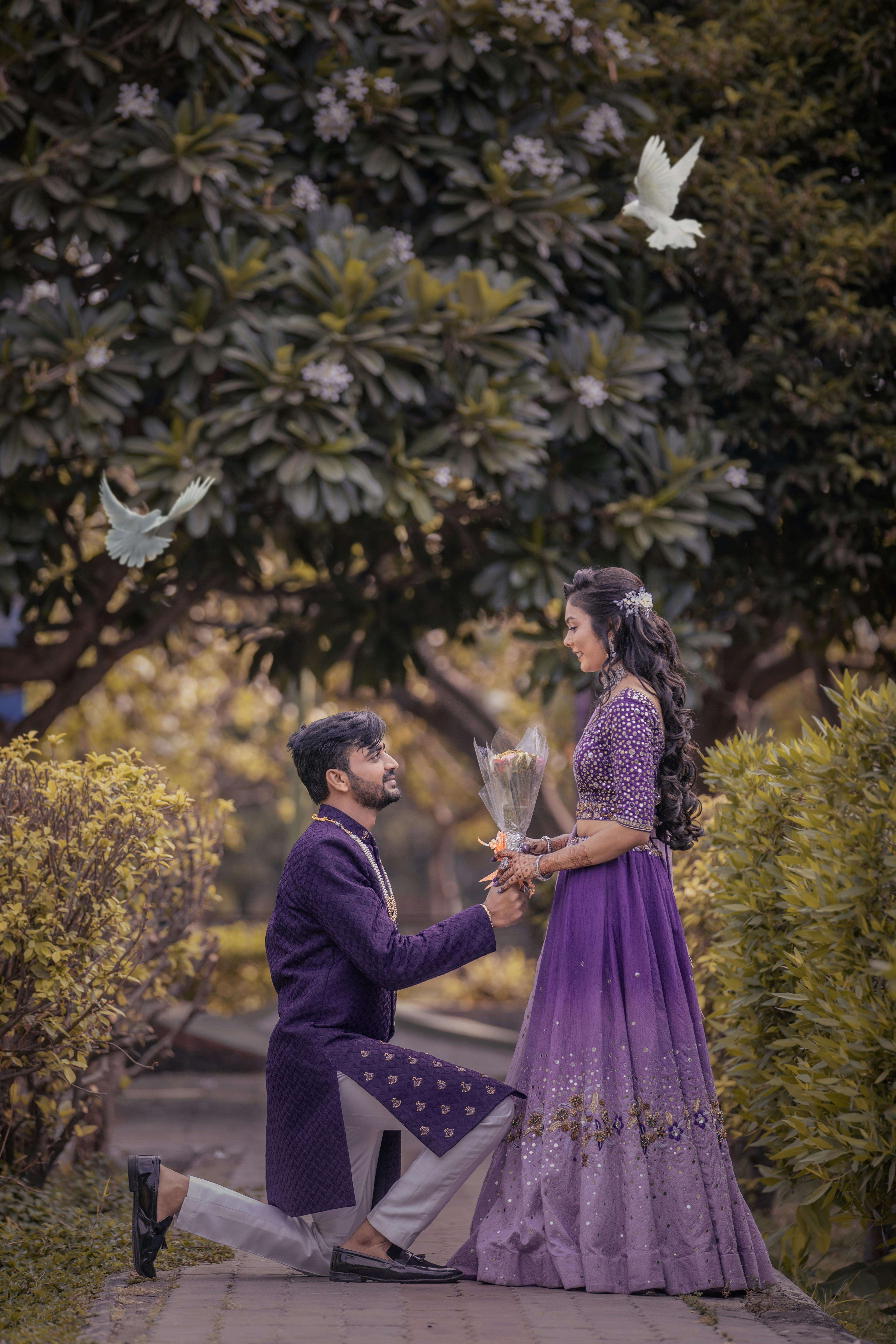 A Newlywed Couple in Purple Dresses  Free Stock Photo