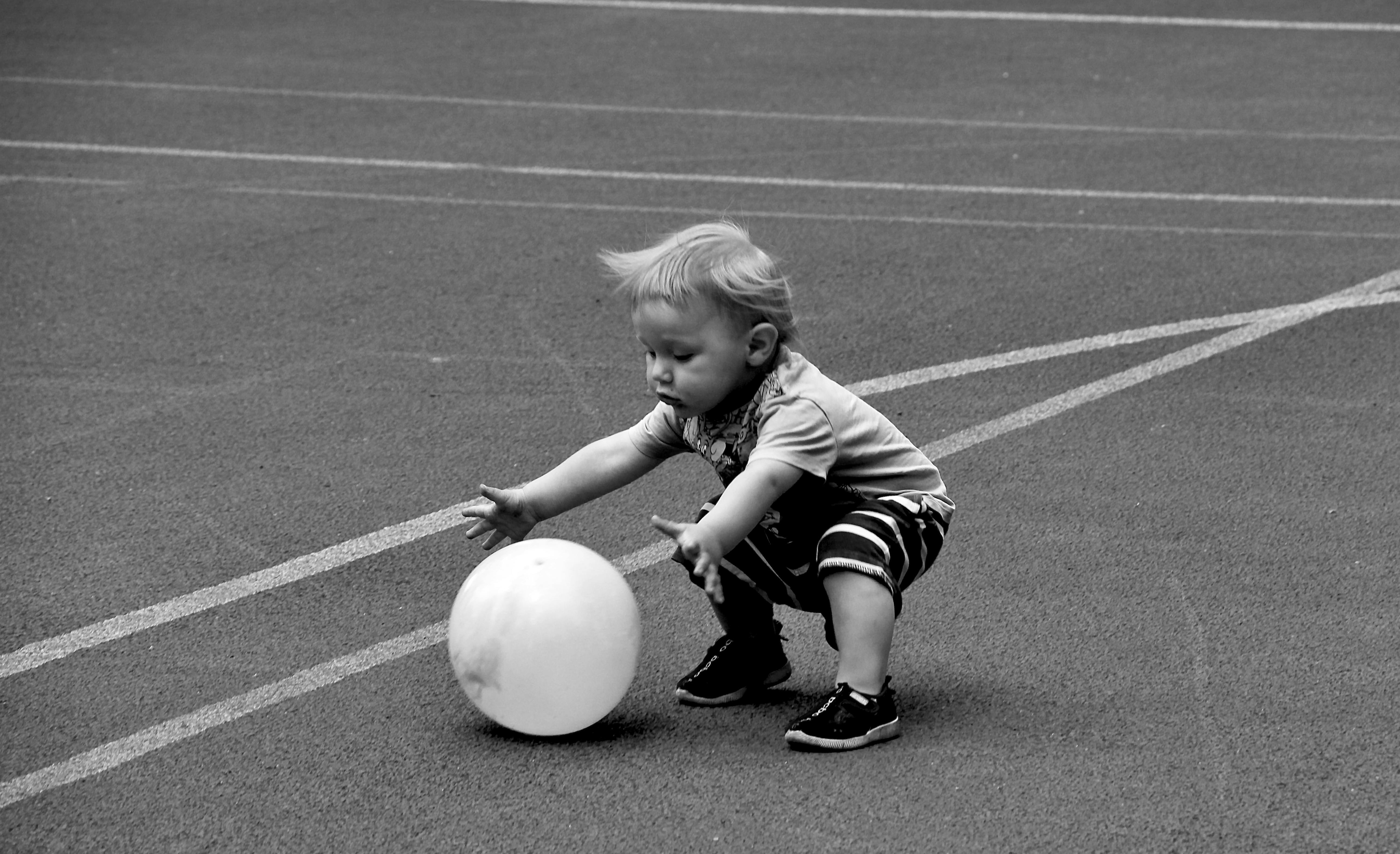 A child playing with a balloon outside, capturing the joy in simple moments