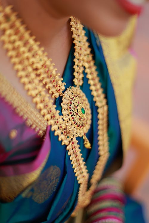Gold Necklace with Gems Worn by a Bride · Free Stock Photo