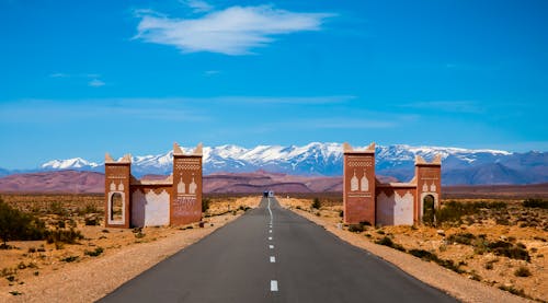 Empty Asphalt Road and Overlooking Mountain