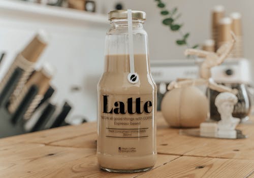 Close-Up Shot of Coffee in a Glass Bottle